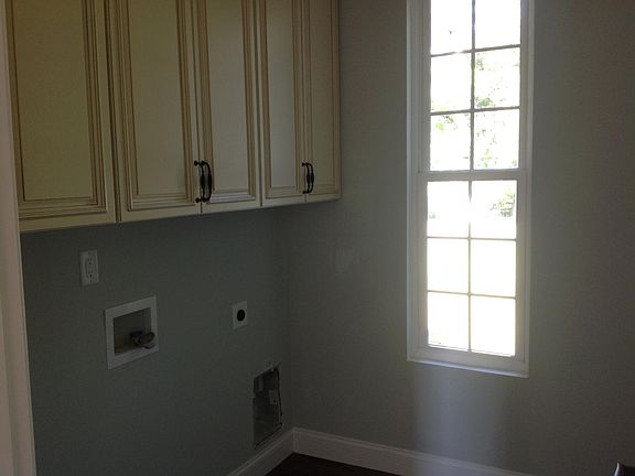 Nice laundry room with a window .