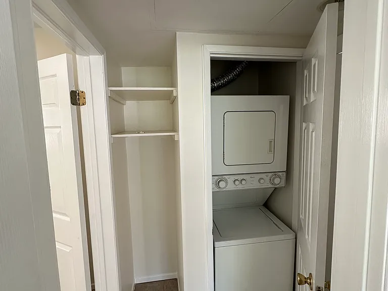 Stacked W/D in unit with side storage