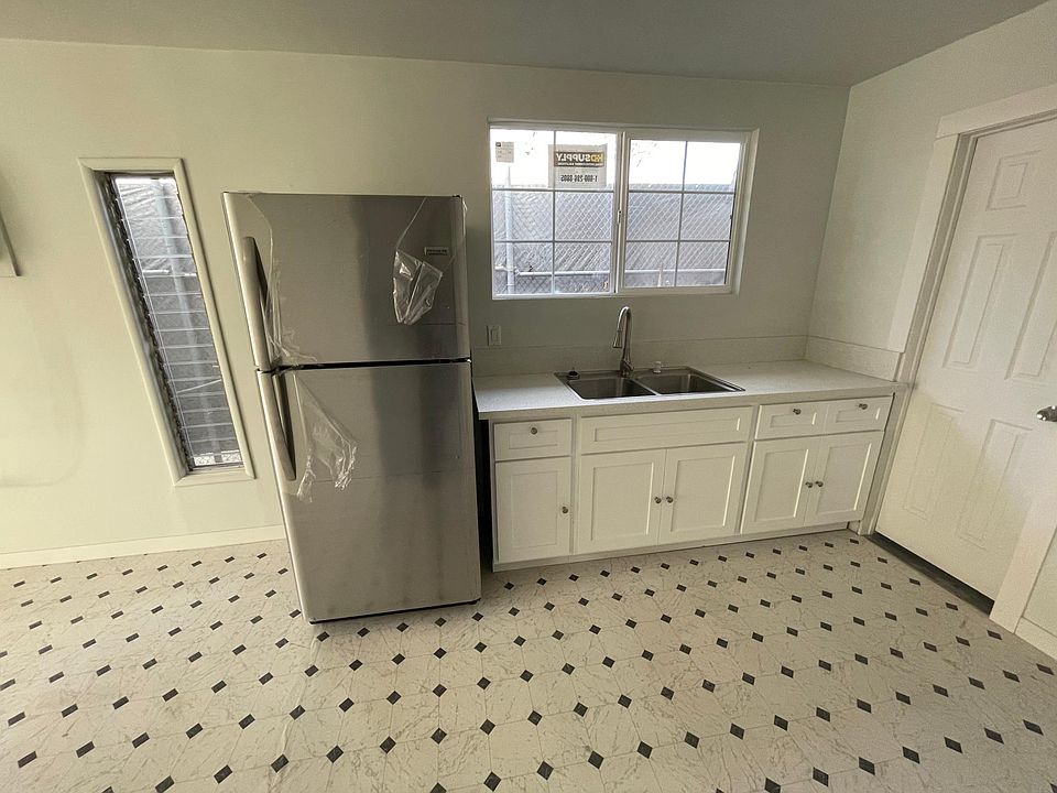 Kitchen ( with view of bedroom door)