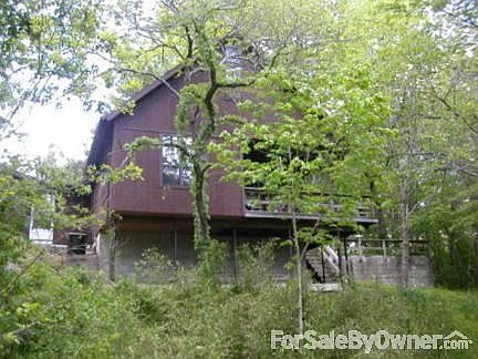 View from the lake
						:
						Looking up at the property and house