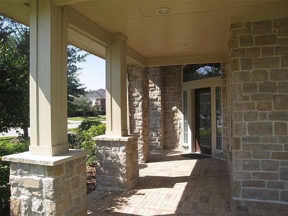 2 car garage with 2 car carport. Arched way for covered fro