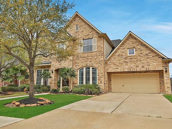 Wide driveway for off-street parking. Currently, there is a 2-car garage with an additional bay turned into a workshop.