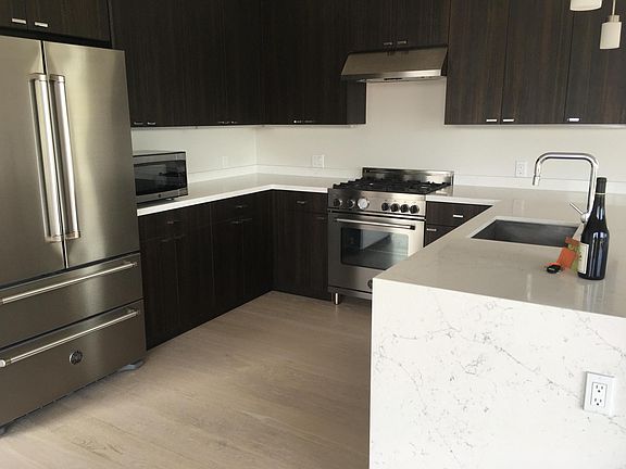 Lots of counter space and new appliances, including a powerful gas range.