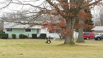 Beautiful old oak trees grace the expansive front yard!