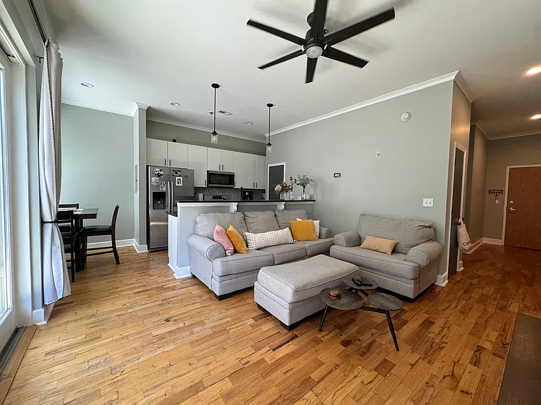 Living area with Kitchen behind.