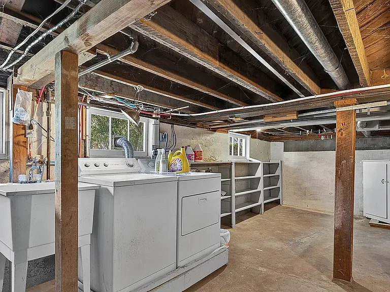 Basement with washer & dryer, storage and outside access