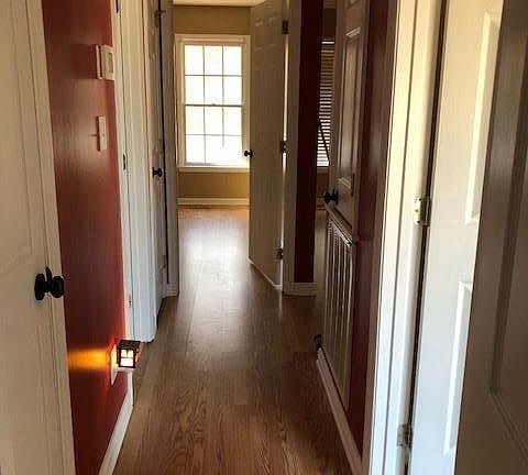 hallway with full bath and 3 bedrooms