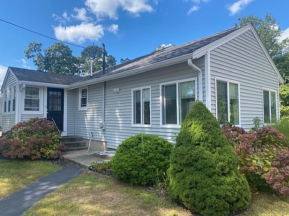 Front of house with walkway that enters mudroom