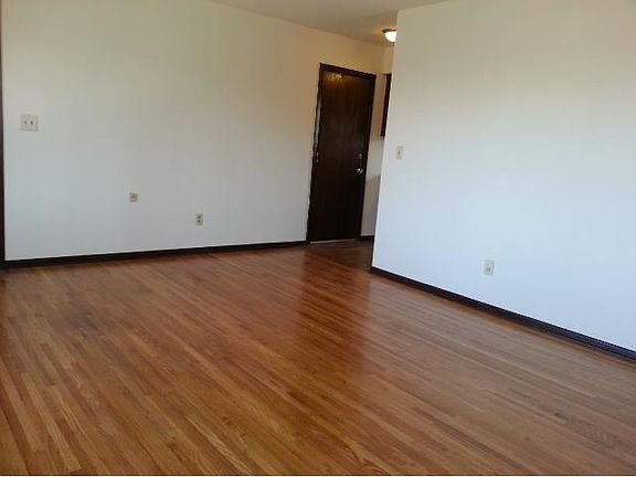 Living room, newly refinished hardwood floor and windows