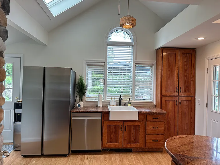Kitchen with updated appliances and palladium window, skylight and cathedral ceiling