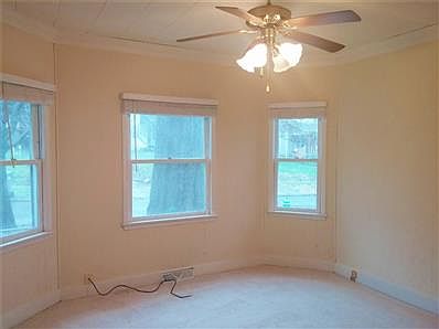 1930s archways and original bannister and light fixture.