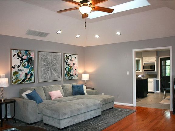 Great room has oak hardwood flooring, vaulted ceiling, & two skylights.  Nothing better than watching a movie at night while it's raining, and hearing the rain on the skylights!  So relaxing!