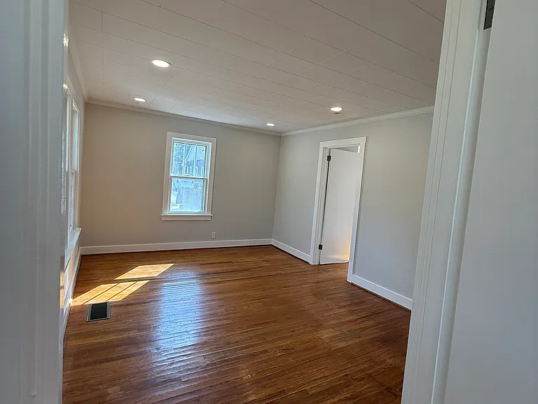 Large open living space with energy efficient LED recessed lighting.