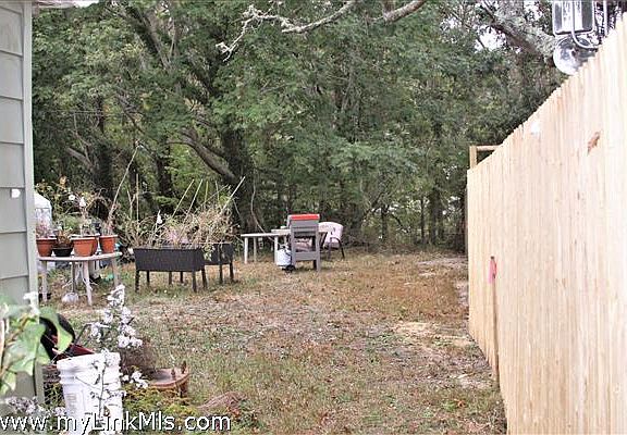 Right side with new lot line fence