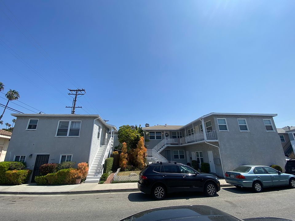 Photo depicting all seven units with the available unit on the top left up the stairs.