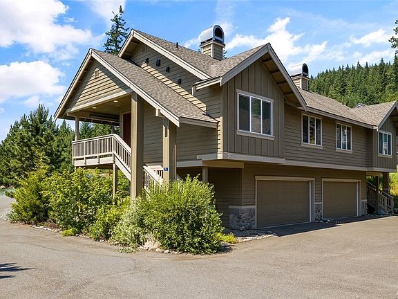 Here's your chance to live in the woods with all the amenities and luxury of a resort life.  Mature greenery surround this 2 bedroom condo providing the outdoors to be right within your reach.  
