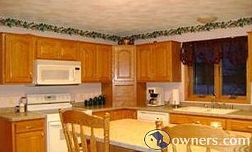 Kitchen w/island and lots of cabinets.