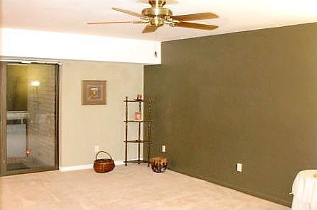 Spacious LR looks out over balcony 