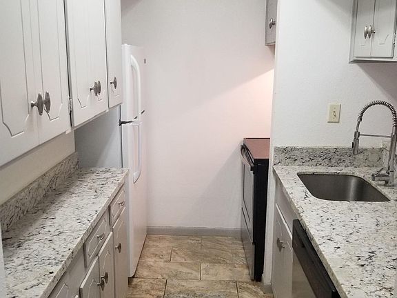 Designer Kitchen with lots of counter-space plus two pantries.