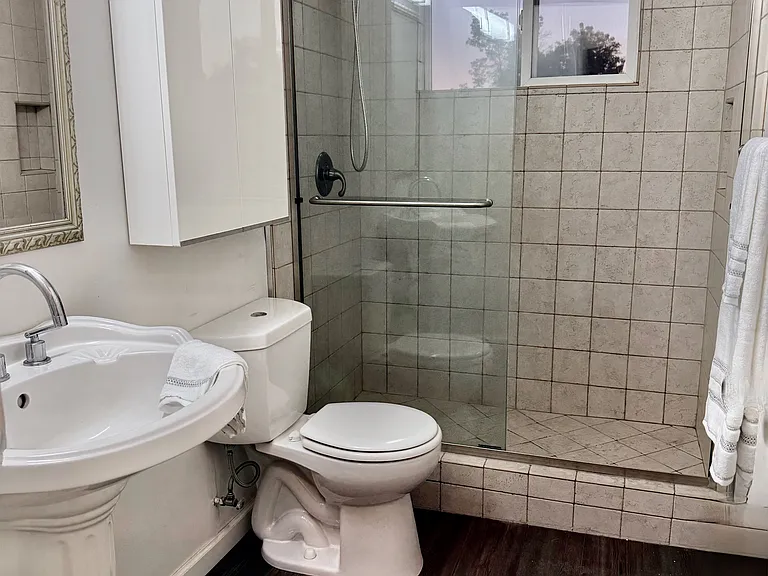 Large Hall Bath w/ waterproof flooring.