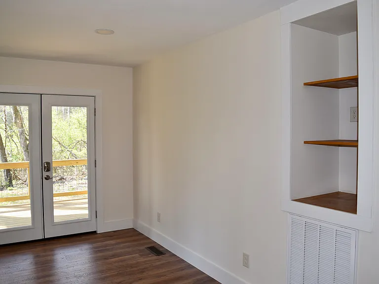 Dining room. Built in shelf with electrical outlet, cable jack, fiber optic jack