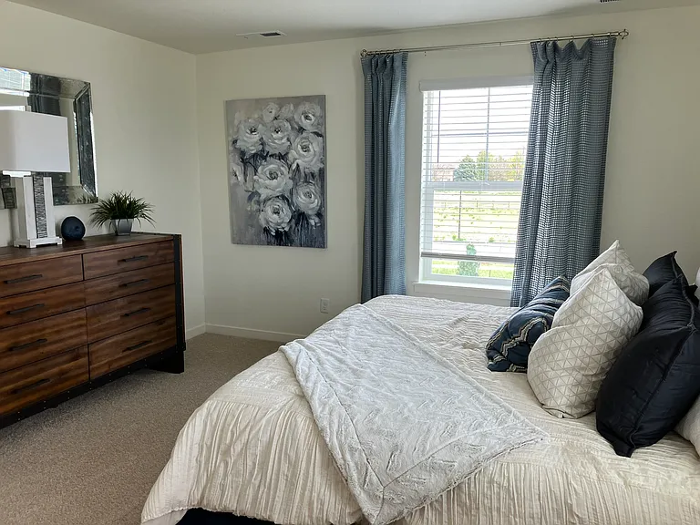 Sample of same floor plan, different finishes, staged with furniture.