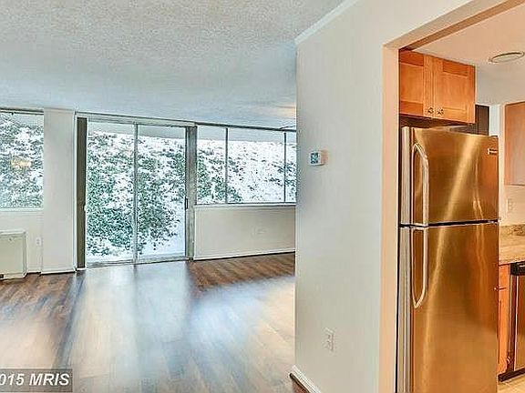 Since this photo was taken, the walls are now a modern grey and a new balcony has been put in as seen in other photos.