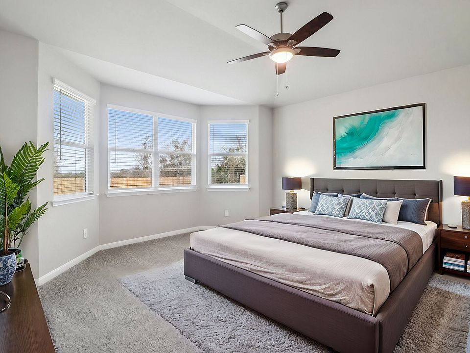 Virtually staged primary suite in the Medina floorplan at a Meritage Homes community.
