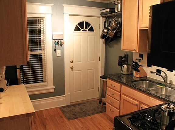 Kitchen looking to back entrace to backyard and off street parking.