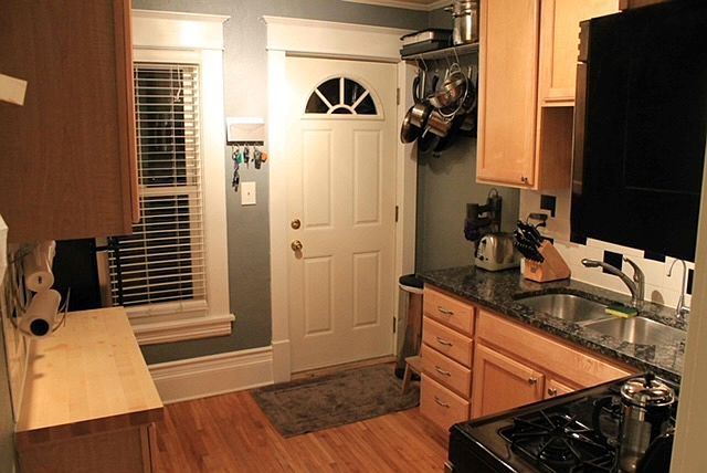 Kitchen looking to back entrace to backyard and off street parking.