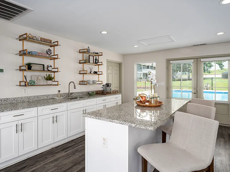 Prepare meals in style with white cabinetry and elegant marble countertops, professionally operated by Highlands Vista Group.