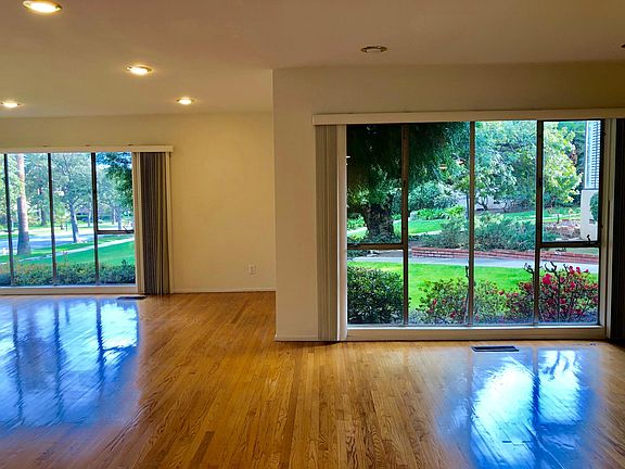 Main Living area overing looking lush landscaping and rose gardens.