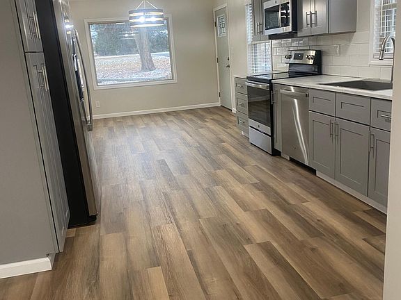 Newly updated kitchen - side by side refrigerator with ice maker, dishwasher, large kitchen sink
