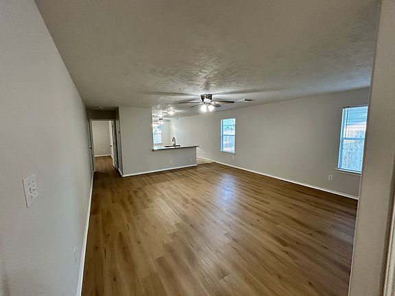Living Room with Kitchen in Background