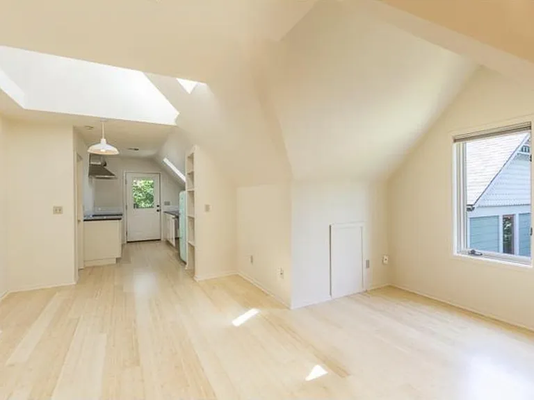Open living area with skylights throughout.