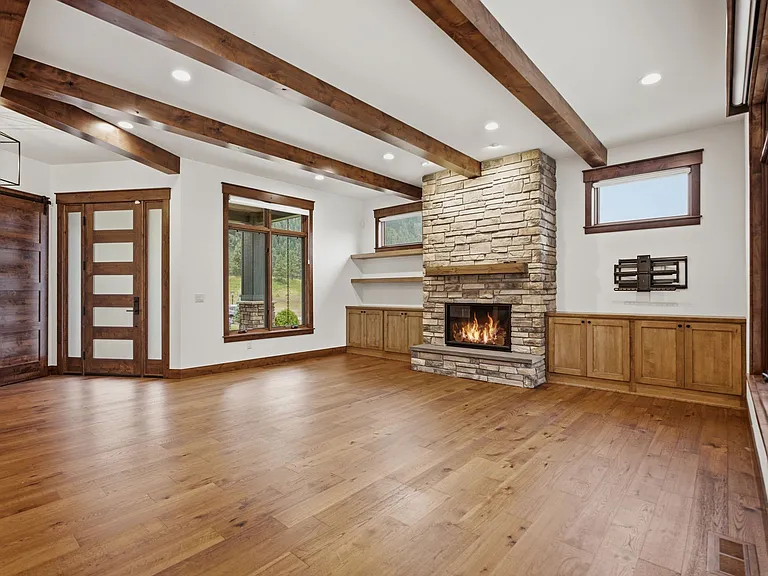 Large family room with built-ins and gas fireplace.