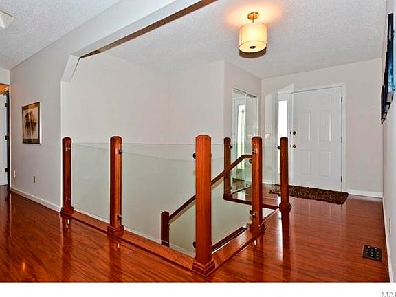 Custom glass banister system - stunning.