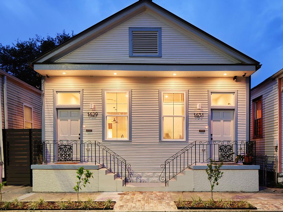 Front of house, apartment located on right.