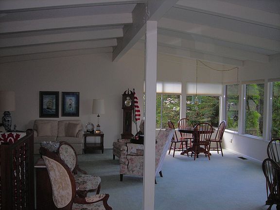 Open and inviting living room with wood beams
