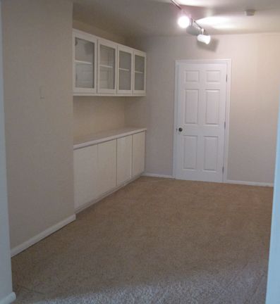 Formal dinning room with built in china cabinets.