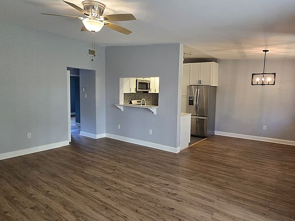 Peek-a-boo kitchen with bar for stools.