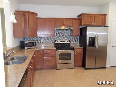 Kitchen with Tiled Backsplash
