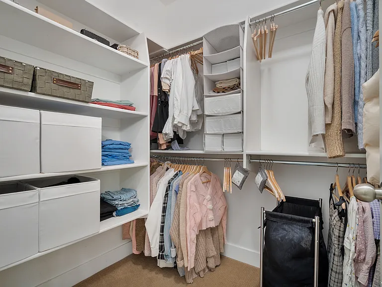Primary walk-in closet.