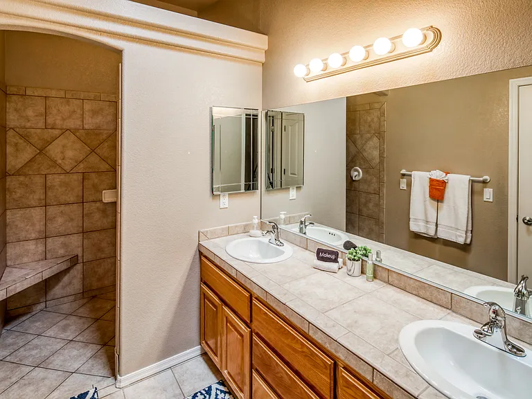 Primary Bathroom - Double Sink, Walk-In Shower, Toilet