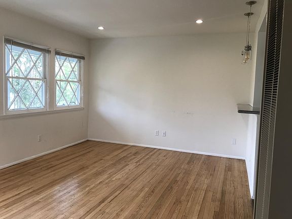 Hardwood floors in living room. Double hang windows. *Picture is not of the actual unit but is similar.