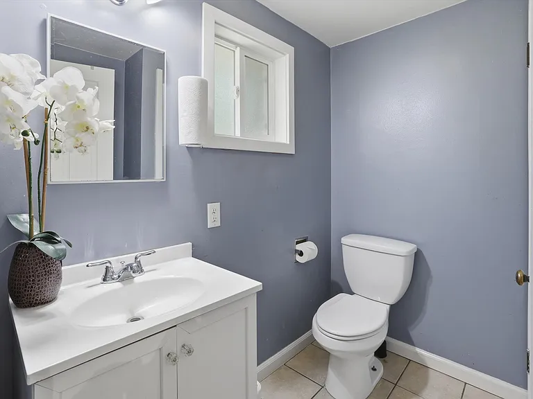 .75 bathroom off of kitchen. Shower located behind the door.