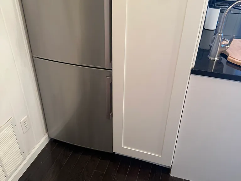 The stainless fridge is a 24" wide counter depth Summit brand.