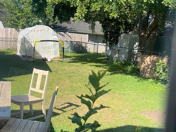 Backyard is fenced along the neighboring borders, chemical free lawn, perennial herb garden, mature raspberries bushes, blooming blueberry bush to come, cherries on behalf of your neighbors, major shade from the Silver Maple