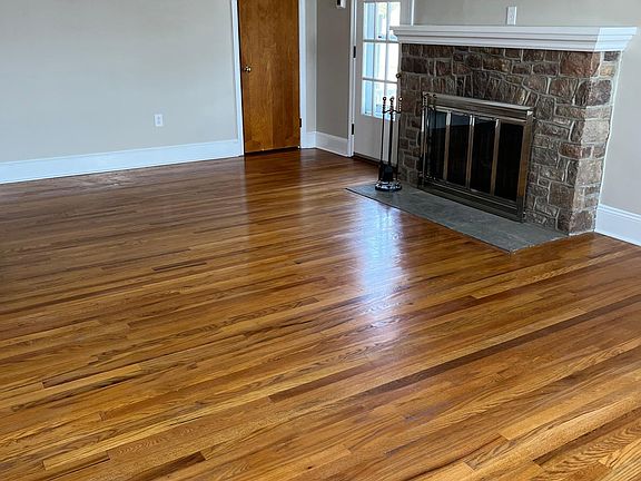 Spacious Living room with gas fireplace opens to a covered deck.