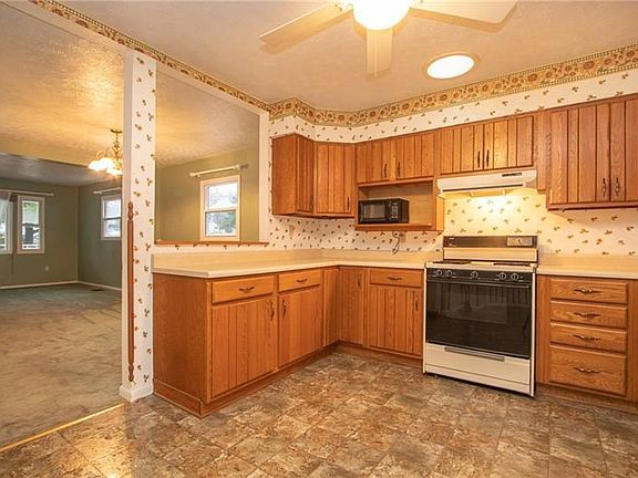 Kitchen view into dining and living areas